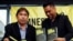 Amnesty International, Philippines' Jose Noel Olano, left, and Wilnor Papa, hold copies of the 2016/17 Amnesty International report which they released at a news conference, Feb. 22, 2017, in suburban Quezon city northeast of Manila, Philippines. 