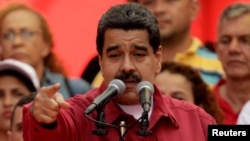 Venezuela's President Nicolas Maduro gives a speech at a rally against U.S President Donald Trump in Caracas, Venezuela, Aug. 14, 2017. 