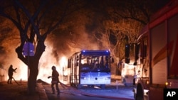 Firefighters work at a scene of fire from an explosion in Ankara, Feb. 17, 2016.