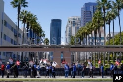 Members of the The Writers Guild of America picket outside Fox Studios on Tuesday, May 2, 2023, in Los Angeles.
