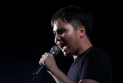 FILE - Student leader Tattep Ruangprapaikitseree speaks during a Thai anti-government mass protest, on the 47th anniversary of the 1973 student uprising, in Bangkok, Oct. 14, 2020.