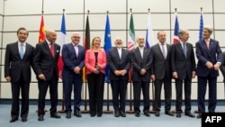 Leaders involved in Iran nuclear talks pose for group photo, July 14, 2015. 