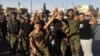 Iraqi security forces and volunteers celebrate in front of Governorate Council Building in Kirkuk, Oct. 16, 2017.