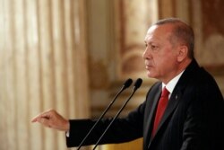 Turkey's President Recep Tayyip Erdogan addresses a conference of parliament speakers in Istanbul, Oct. 11, 2019.