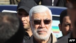 FILE - Abu Mahdi al-Muhandis, a commander in the Popular Mobilization Forces, attends the funeral procession of Hashed al-Shaabi fighters in Baghdad, Dec. 31, 2019.