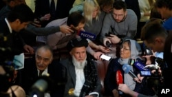 Participants of the conference on Afghanistan including representatives of the Afghan authorities and the Taliban speak to journalists in Moscow, Russia, Nov. 9, 2018. 