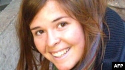 FILE - This undated handout photo shows Kayla Jean Mueller, 26. It was obtained Feb. 6, 2015, courtesy of the Mueller family and the office of U.S. Senator John McCain. 