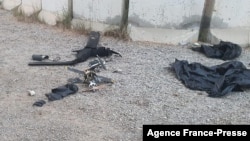 A picture obtained from a senior coalition official shows the remains of two armed drones at the site where the US-led coalition against the Islamic State (IS) group in Iraq said it shot down two drones at Baghdad airport, Jan. 3, 2022. (Photo by handout/AFP)