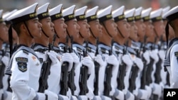 FILE - Soldiers from China's People's Liberation Army (PLA) Navy march in formation during a parade to commemorate the 70th anniversary of the founding of Communist China in Beijing, Oct. 1, 2019.