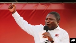 FILE - Ruling Frelimo Party leader and President Filipe Nyusi, at an election rally in Maputo, Mozambique, Oct. 12, 2019.. 