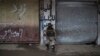 A Iraqi soldier sits in a neighborhood recently retaken by Iraqi security forces during fights with Islamic State militants on the western side of Mosul, Iraq, March 23, 2017.