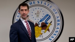 Republican Senator Tom Cotton arrives in his office on Capitol Hill in Washington, March 11, 2015.