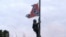 Bree Newsome of Charlotte, N.C., climbs a flagpole to remove the Confederate battle flag at a Confederate monument in front of the Statehouse in Columbia, S.C., June, 27, 2015. 