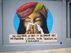 In a country with a low literacy rate, art can help spread important information about how to stay safe during the coronavirus outbreak. (Alpha Sy)