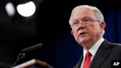Attorney General Jeff Sessions speaks during a news conference to announce a criminal law enforcement action involving China, at the Department of Justice in Washington, Nov. 1, 2018. 