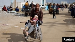 Palestinian patients arrive in Rafah after they were evacuated from Nasser Hospital in Khan Younis due to the Israeli ground operation, amid the ongoing conflict between Israel and Hamas, in the southern Gaza Strip, Feb. 15, 2024.