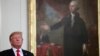 FILE - President Donald Trump stands near a portrait of George Washington in the East Room of the White House, April 18, 2019, in Washington.