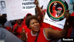 FILE - Protesters demonstrate against Ugandan President Yoweri Museveni outside Uganda House in London, Britain, Aug 23, 2018. 
