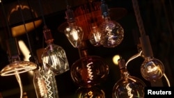 Light bulbs are displayed for sale amid record-high energy prices, at an electrical shop in Madrid, Spain, Sept. 9, 2021.