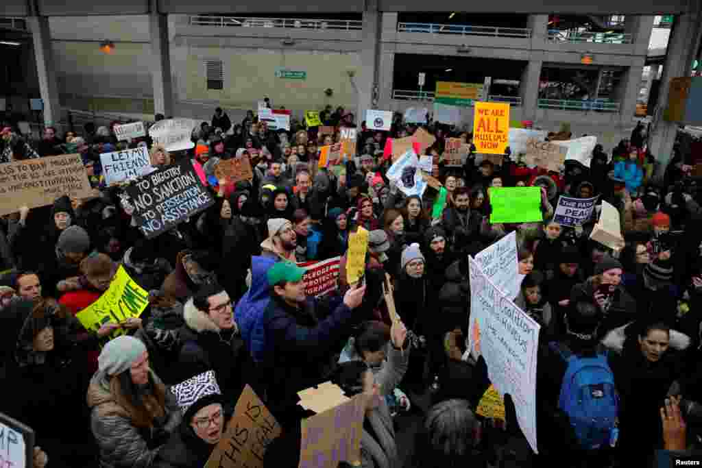 A crowd gathers during an anti-Donald Trump immigration ban protest outside Terminal 4 at John F. Kennedy International Airport in Queens, New York, Jan. 28, 2017.