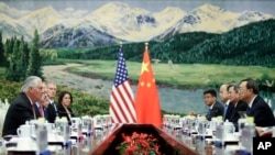 U.S. Secretary of State Rex Tillerson, left, meeting with China's State Councilor Yang Jiechi at the Great Hall of the People, Saturday, Sept. 30, 2017, in Beijing, China.