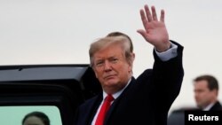 U.S. President Donald Trump waves as he arrives at Akron-Canton airport in Canton, Ohio, March 20, 2019.