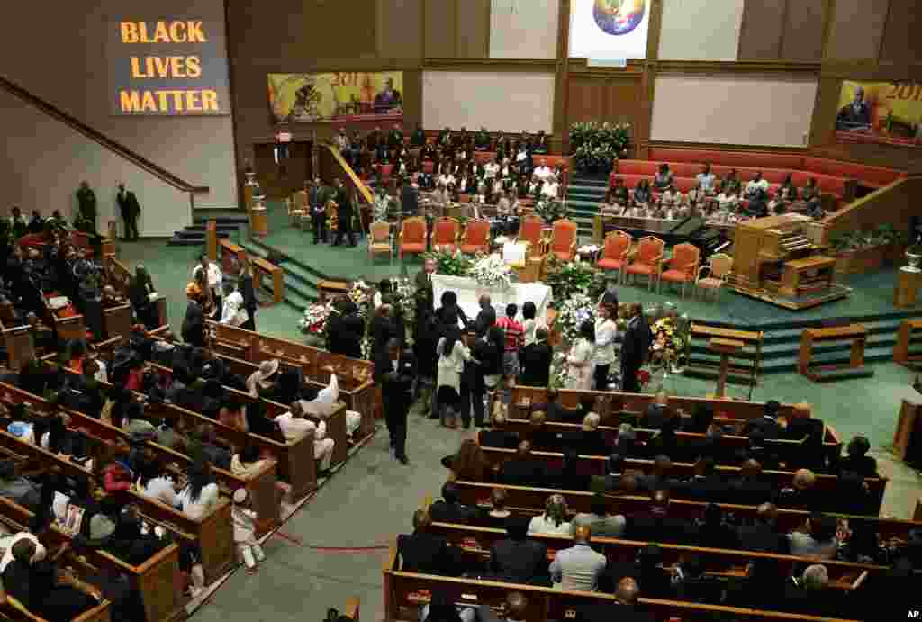 Friends and family of Freddie Gray gather around his casket before his funeral at New Shiloh Baptist Church in Baltimore, April 27, 2015.