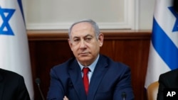 FILE - Israeli Prime Minister Benjamin Netanyahu chairs a weekly cabinet meeting in Jerusalem, Jan. 5, 2020.