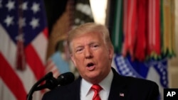President Donald Trump speaks in the Diplomatic Room of the White House, Oct. 27, 2019, in Washington.