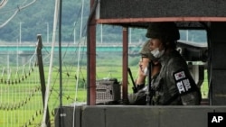 FILE - South Korean army soldiers stand guard at a military post at the Imjingak Pavilion in Paju, South Korea, near the border with North Korea, Aug. 2, 2021. 