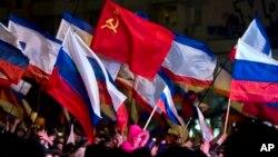 Pro-Russian people celebrate in Lenin Square, in Simferopol, Ukraine, March 16, 2014.