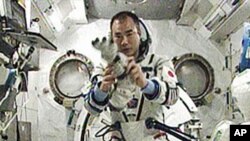 Expedition 23 Flight Engineer Soichi Noguchi, representing the Japan Aerospace Exploration Agency, tries on the Russian Sokol pressurized spacesuit he will wear when he rides the Soyuz TMA-17 spacecraft back to Earth, 31 May 2010