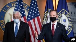 Rep. Adam Schiff, chairman of the House Intelligence Committee, right, speaks accompanied by House Majority Leader Steny Hoyer, during a news conference on Capitol Hill, after a meeting at the White House, in Washington, June 30, 2020.