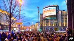People gather to attend the opposition rally in support of jailed opposition leader Alexei Navalny in the historical center of Moscow, Russia, April 21, 2021.