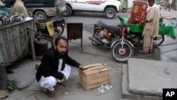 Mustafa Kharal, lawyer of pregnant woman Farzana Parveen who was stoned to death, shows the area where she was killed in Lahore, Pakistan, May 28, 2014