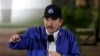 Nicaraguan President Daniel Ortega speaks during the opening ceremony for a highway overpass in Managua, Nicaragua, Nov. 29, 2018.
