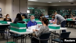 FILE - Mail-in ballots are counted in Lehigh County, Pennsylvania, November 4, 2020.