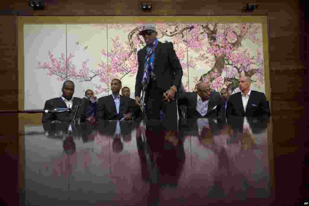 Dennis Rodman stands up to leave after he and fellow U.S. basketball players completed a television interview at a Pyongyang hotel, Jan. 7, 2014.