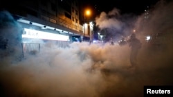 A man is seen after riot police fired tear gas after a sit-in at Yuen Long to protest against violence two months ago when white-shirted men wielding pipes and clubs wounded anti-government protesters and passers-by, in Hong Kong, Sept. 21, 2019.