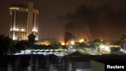 Smoke rises from the site of car bomb attack in Baghdad, May 29, 2015. 