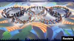 FILE - Performers take part in the closing ceremony of the 2016 Rio Olympics in Rio de Janeiro, Brazil, Aug. 21, 2016.