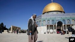 FILE - A Palestinian walks in front of the Dome of the Rock ahead of the prayers in Jerusalem, Dec. 8, 2017.