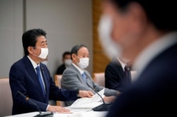 Japan's Prime Minister Shinzo Abe speaks during a meeting about the measures against the coronavirus disease (COVID-19), at the prime minister official residence in Tokyo, Japan, April 6, 2020.
