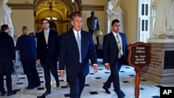House Speaker John Boehner walks back to his office on Capitol Hill in Washington, Jan. 14, 2015.