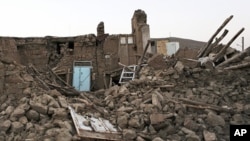Ruins of a building in a village near the city of Varzaqan in northwestern Iran, after an earthquake, Aug. 13, 2012. 