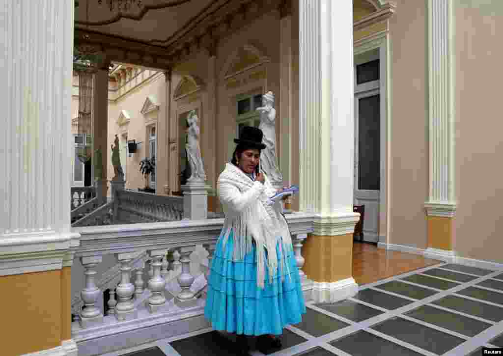 Elizabeth Mamani, 36, a reporter at Radio Union, poses inside Bolivia&#39;s national congress building in La Paz, Bolivia, Feb. 22, 2017. &quot;When I started in this job, I did feel discrimination [from officials who controlled the access of members of the press to events]. To counter discrimination in this profession, we as women, must excel, we must prepare ourselves in every field,&quot; Mamani said.