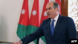 A handout picture released by the Jordanian Royal Palace on Sept. 28, 2016 shows Jordan's Prime Minister Hani Mulki taking a oath at the swearing-in ceremony of Jordan's new government in Amman. Jordan's King Abdullah II re-appointed Prime Minister Hani al-Malki on September 25,2016 to form a new government following elections in which the Muslim Brotherhood made its return as a parliamentary force. 