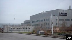 FILE - An SAIC Volkswagen plant is seen in the outskirts of Urumqi in northwestern China's Xinjiang Uyghur Autonomous Region, April 22, 2021. The European Union has moved closer to banning products made from forced labor.