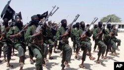 FILE - Hundreds of newly trained al-Shabab fighters perform military exercises in the Lafofe area 18 km south of Mogadishu, Somalia, Feb. 17, 2017. Tuesday's U.S. drone strike reportedly targeted an al-Shabab training camp in Somalia's Bay region.