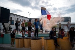 Protesters block a highway during a demonstration in Marseille, southern France, Aug. 7, 2021. Thousands of people marched in Paris and other French cities during a fourth consecutive week of protests against COVID-19 entrance requirements.